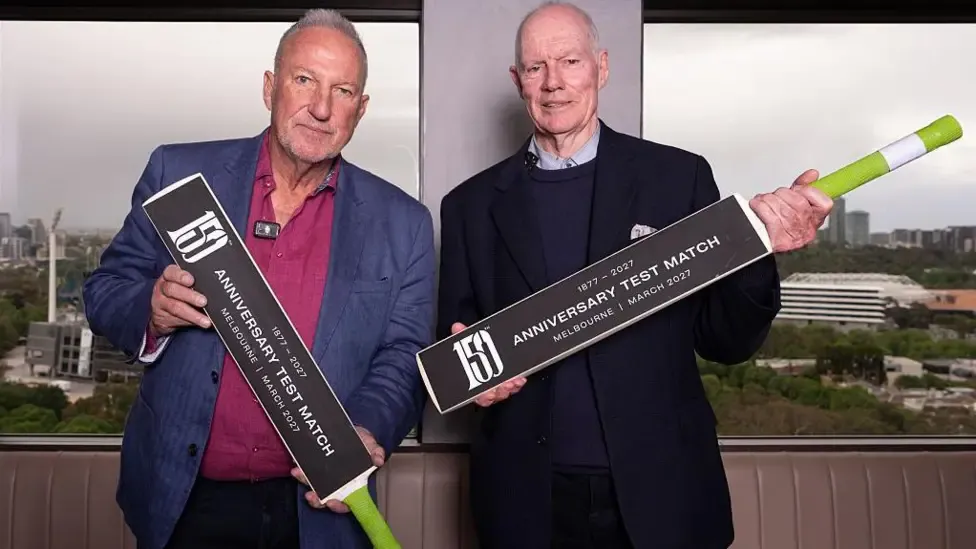 Former England captain Ian Botham and ex-Australia skipper Greg Chappell holding bats to promote the 150th anniversary Test