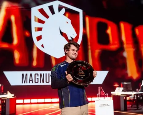Magnus Carlsen displays the trophy after winning the chess tournament at the 2026 Esports World Cup